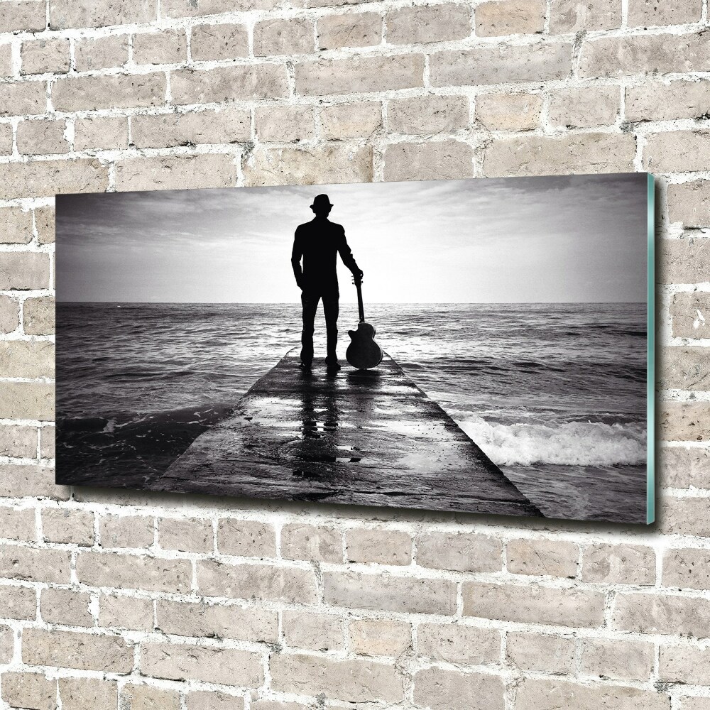 Photo printed on glass Guitarist on the pier