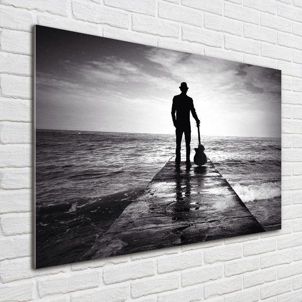 Photo printed on glass Guitarist on the pier