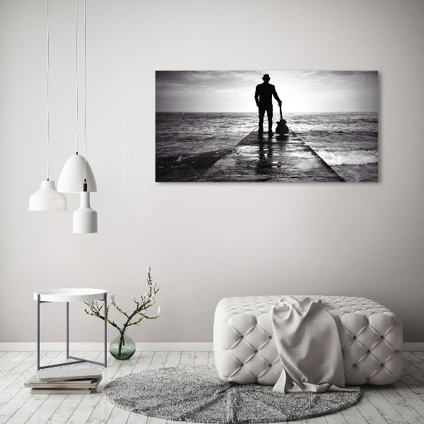 Photo printed on glass Guitarist on the pier