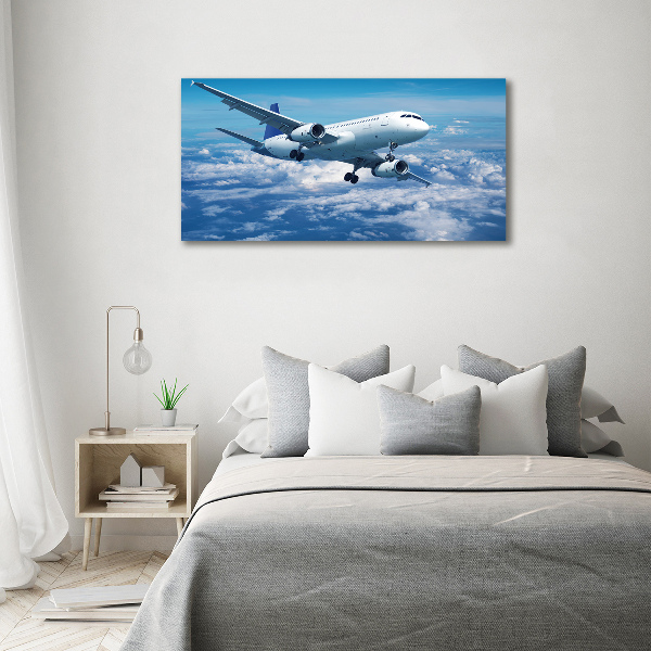 Glass wall art Aircraft in the clouds