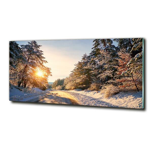 Glass wall art large Road in the forest in winter