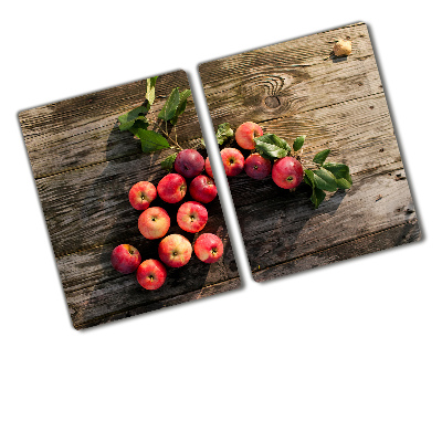 Chopping board glass Apples on the table