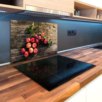 Chopping board glass Apples on the table