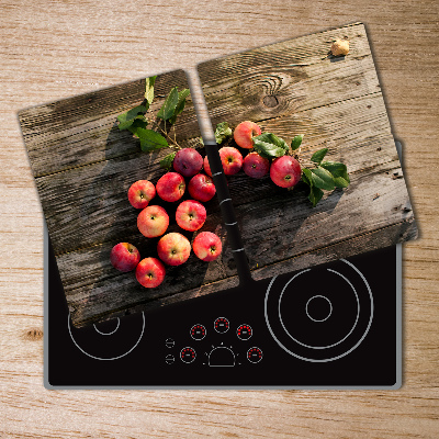 Chopping board glass Apples on the table