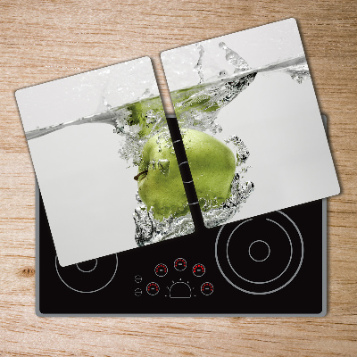 Chopping board glass Apple under water