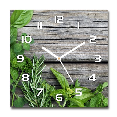 Square kitchen clock Wooden background herbs