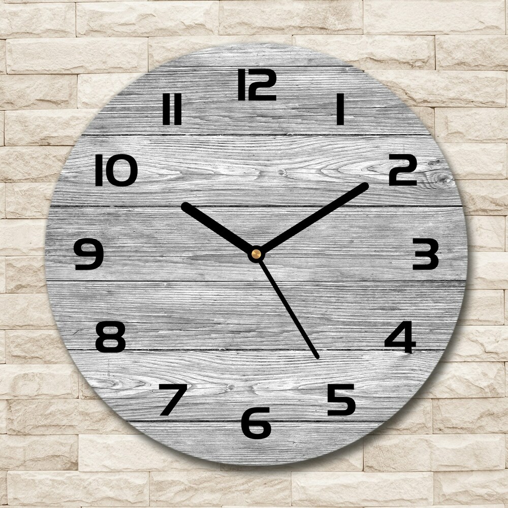 Round glass wall clock Wooden background