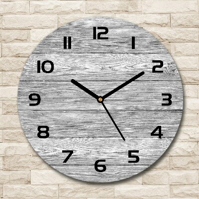 Round glass wall clock Wooden background