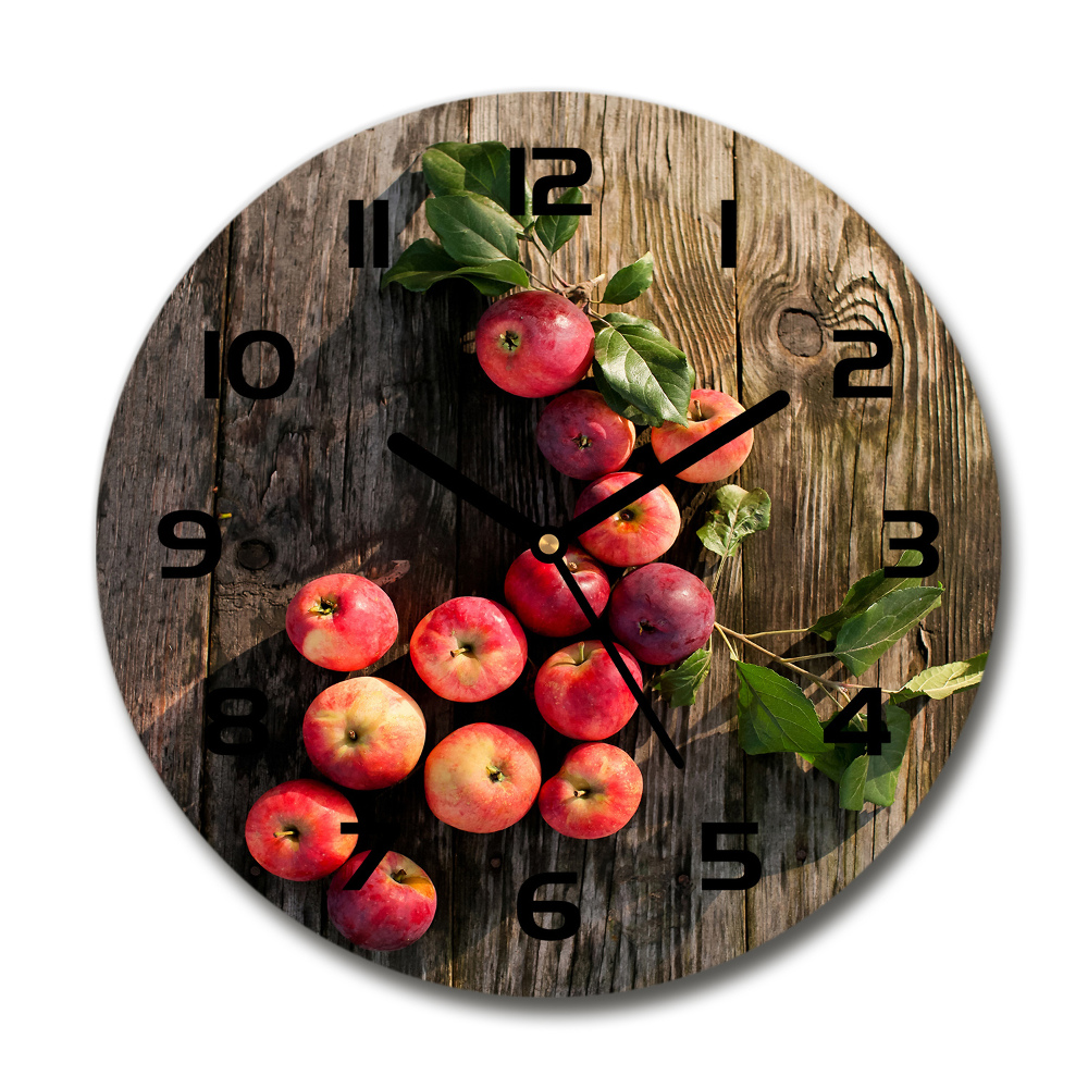 Round glass clock Apples on the table