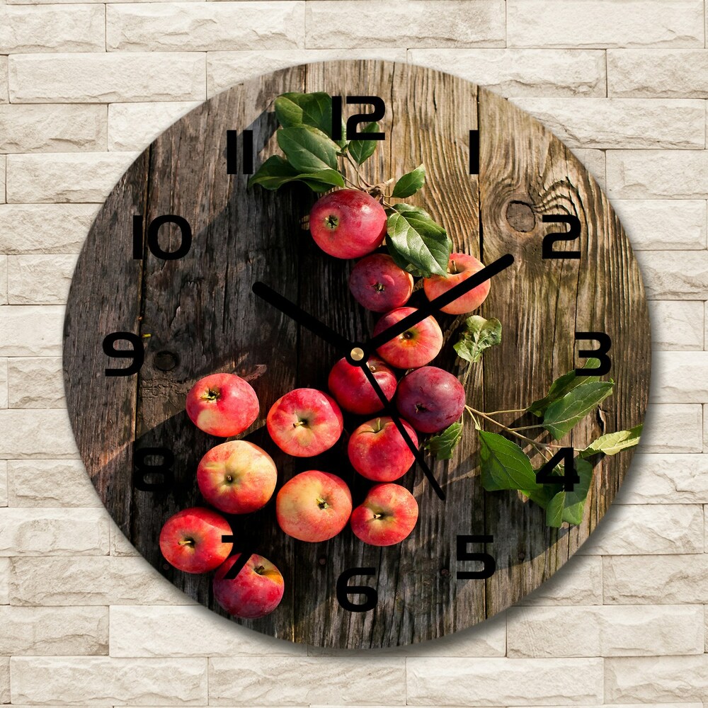 Round glass clock Apples on the table