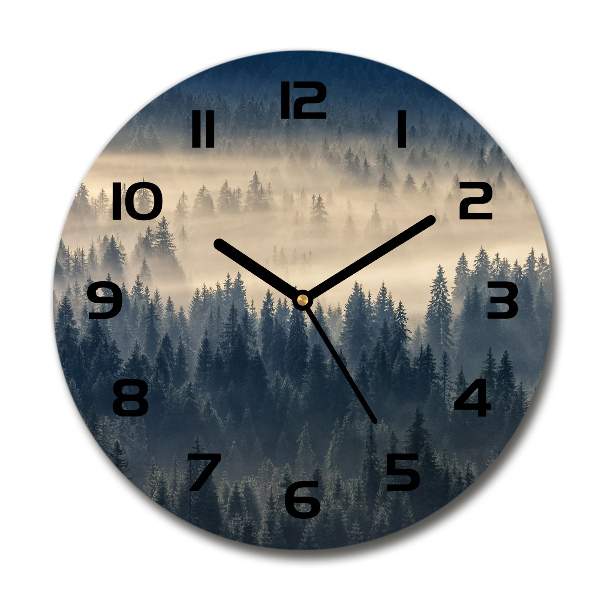 Round clock glass Fog over the forest