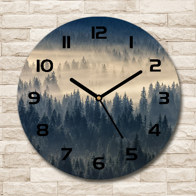 Round clock glass Fog over the forest