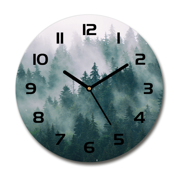 Round wall clock Fog over the forest