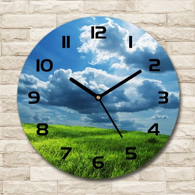 Round wall clock Clouds above the field