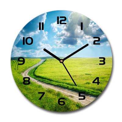 Round wall clock Path in the meadow