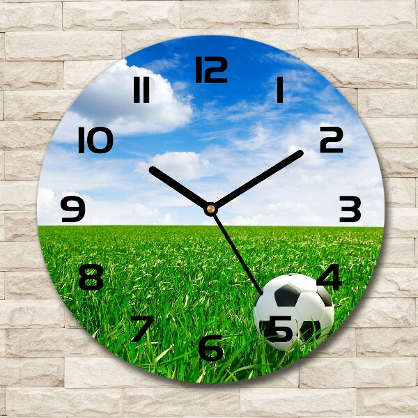 Round glass clock Football in the meadow