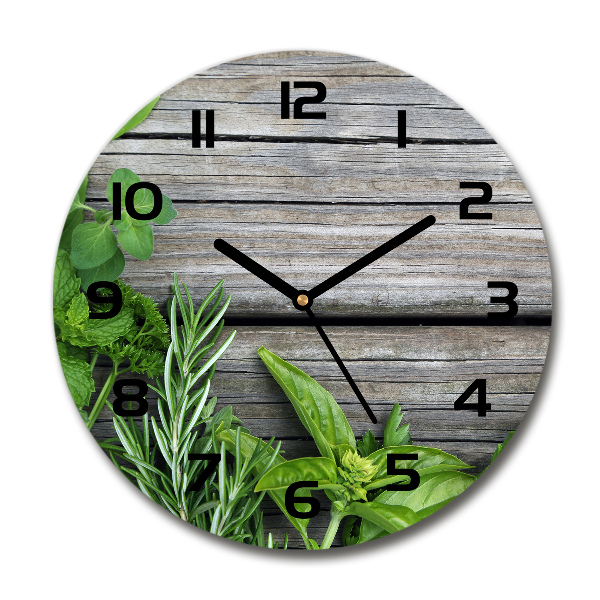 Round wall clock Wooden background herbs