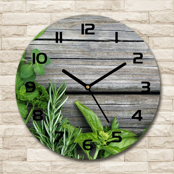 Round wall clock Wooden background herbs