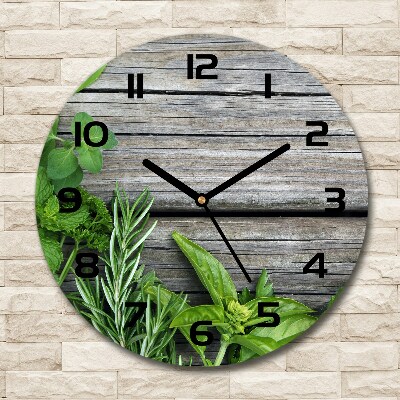 Round wall clock Wooden background herbs