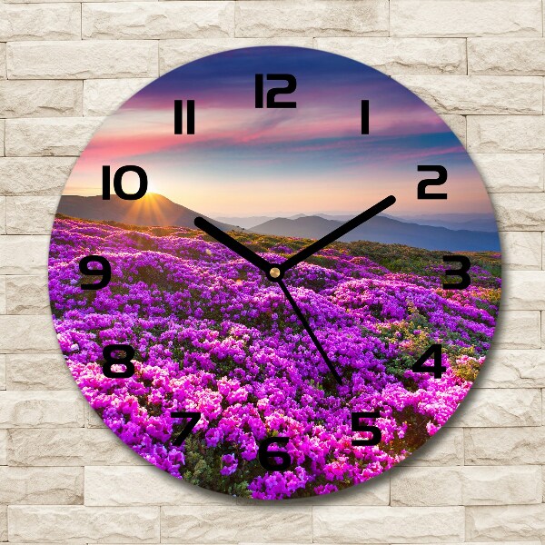 Round glass clock Flowers in the mountains