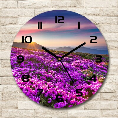 Round glass clock Flowers in the mountains