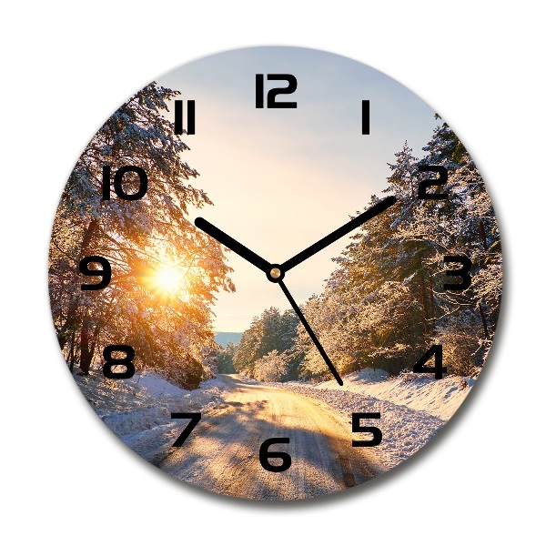 Round wall clock Road in the forest in winter