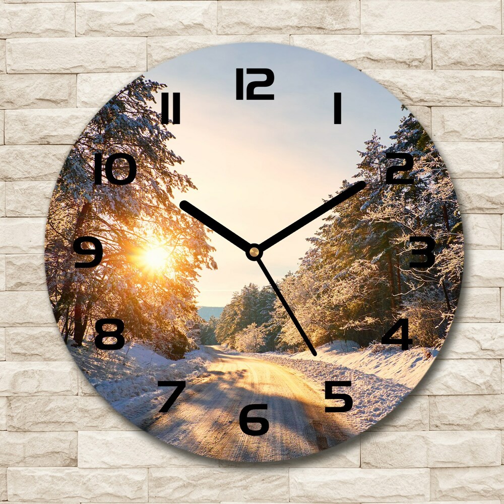 Round wall clock Road in the forest in winter