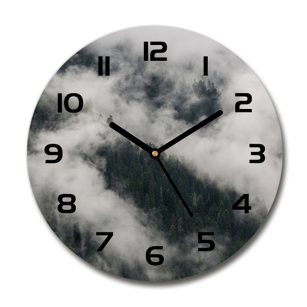 Round wall clock Fog over the forest