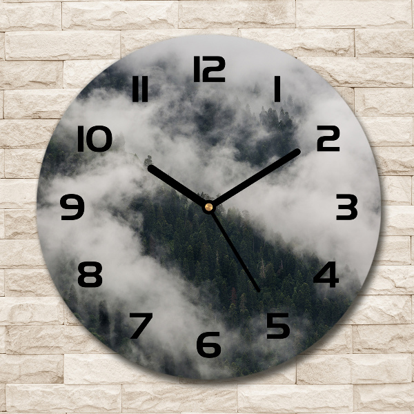 Round wall clock Fog over the forest