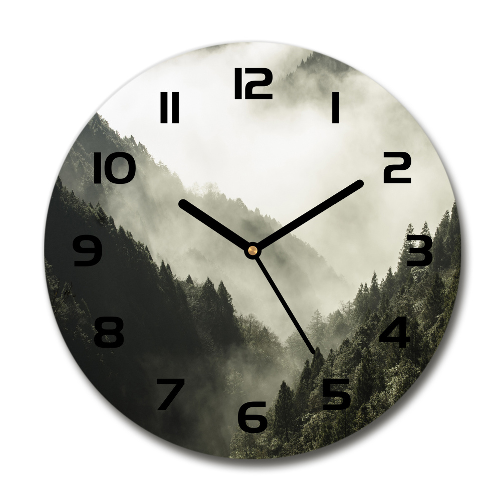 Round glass wall clock Fog over the forest