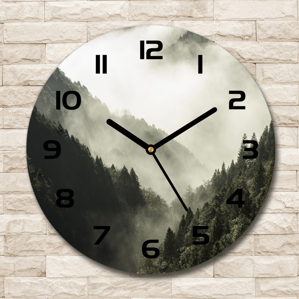 Round glass wall clock Fog over the forest