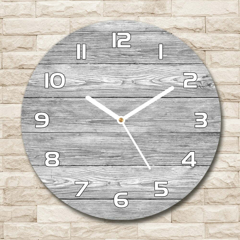 Round glass wall clock Wooden background