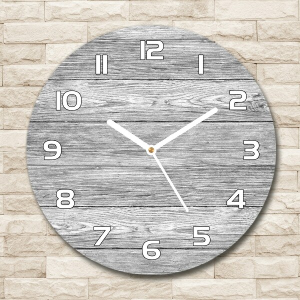 Round glass wall clock Wooden background