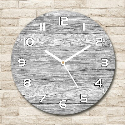 Round glass wall clock Wooden background