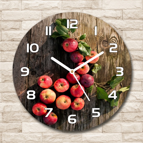 Round glass clock Apples on the table