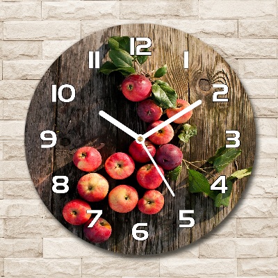 Round glass clock Apples on the table