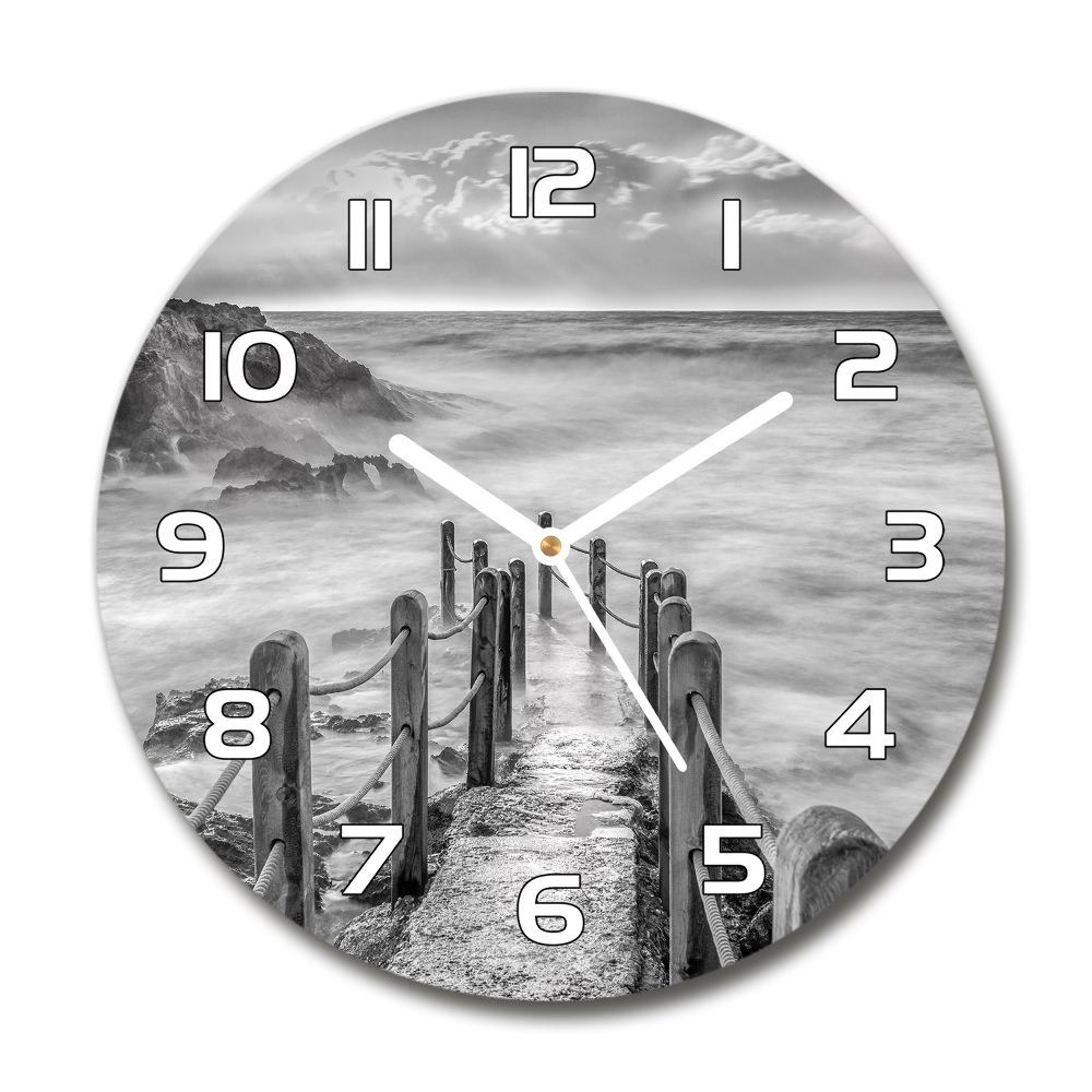 Round glass wall clock Path at the sea