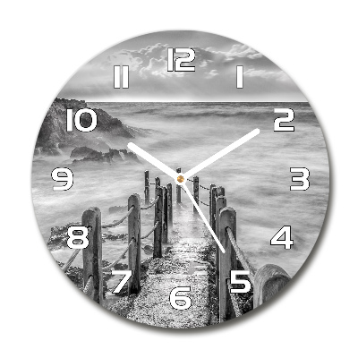 Round glass wall clock Path at the sea