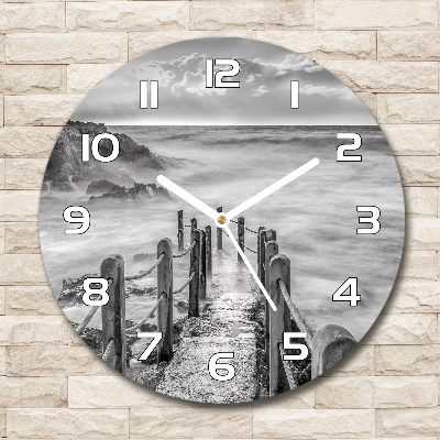 Round glass wall clock Path at the sea