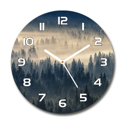 Round clock glass Fog over the forest