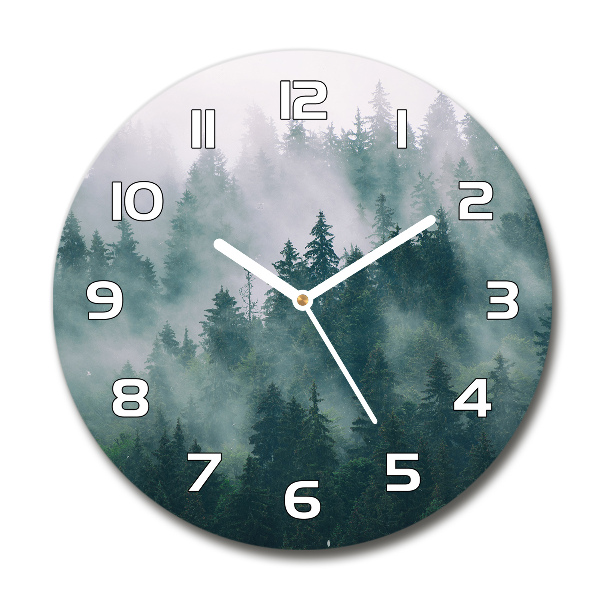 Round wall clock Fog over the forest