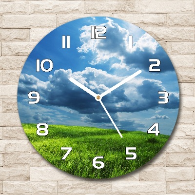 Round wall clock Clouds above the field