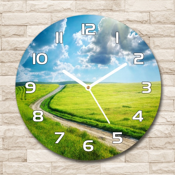 Round wall clock Path in the meadow