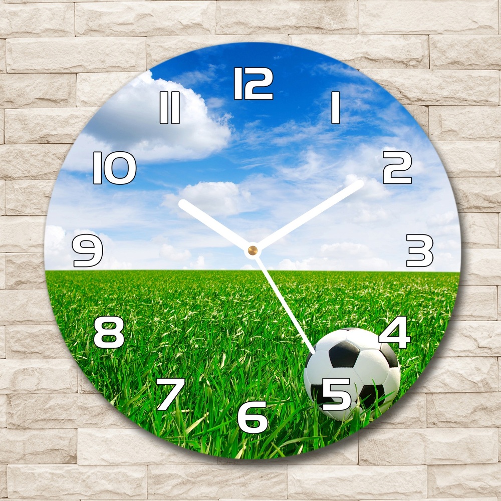 Round glass clock Football in the meadow