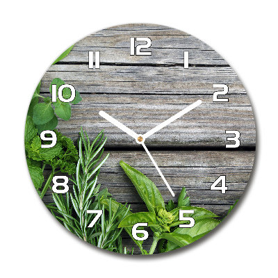 Round wall clock Wooden background herbs