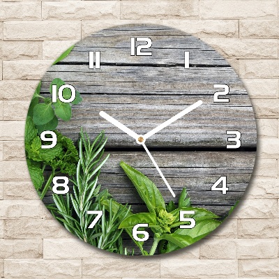 Round wall clock Wooden background herbs