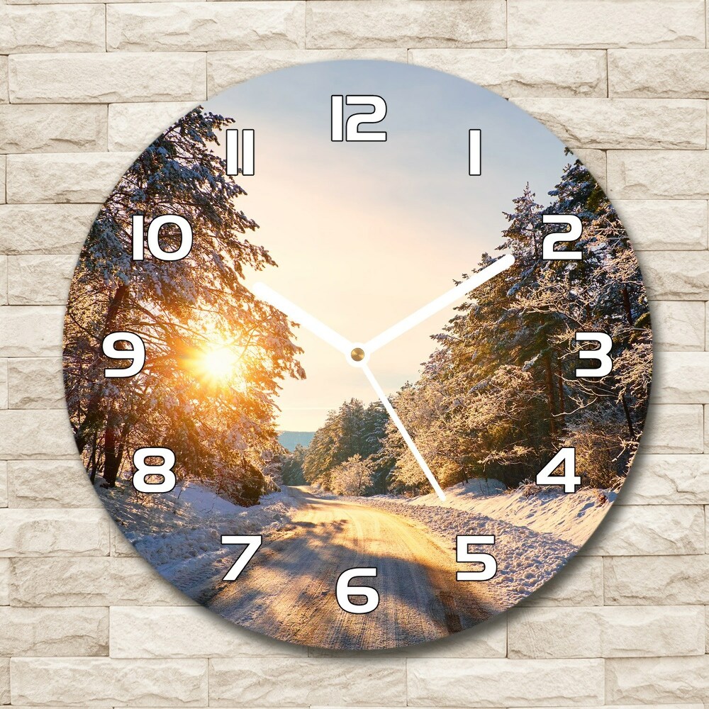 Round wall clock Road in the forest in winter