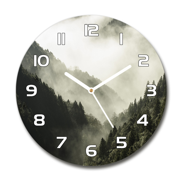 Round glass wall clock Fog over the forest