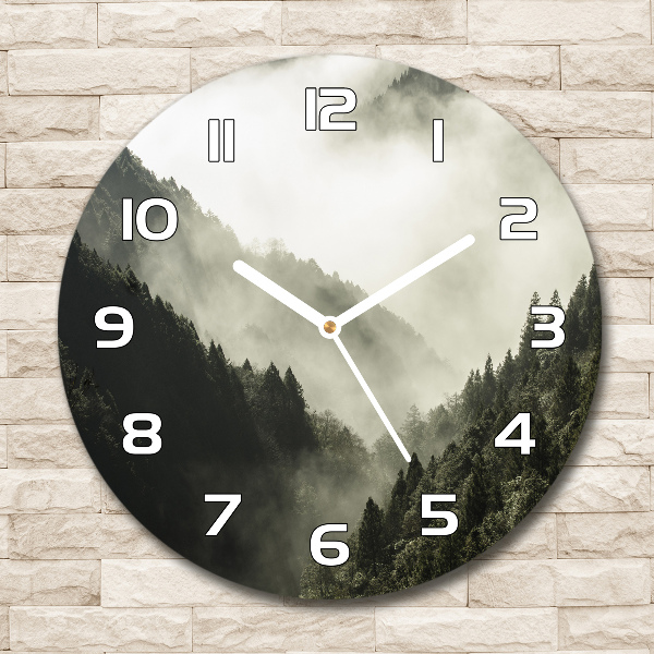 Round glass wall clock Fog over the forest