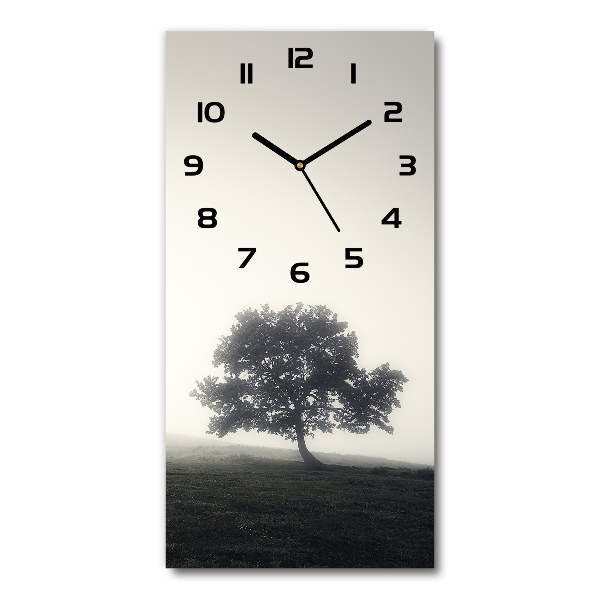 Vertical wall clock Tree in the fog